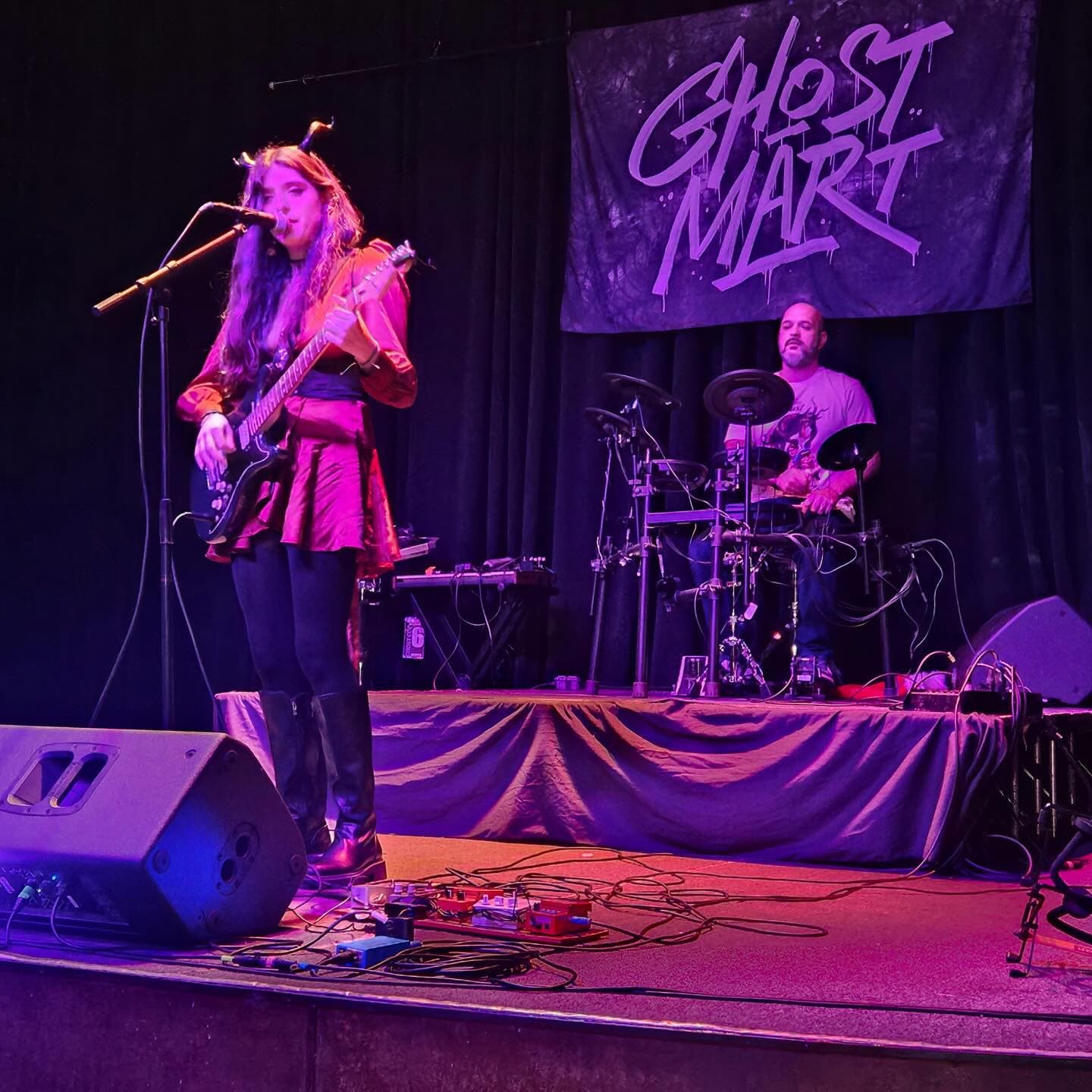Large photos of other Yilk playing a live performance